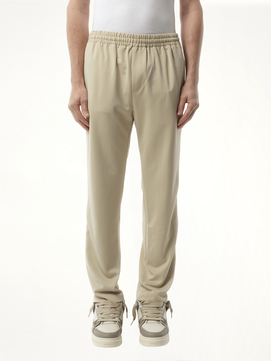 Image of a model wearing Pants. Productname: REPRESENT Tailored Track Pant in GREY colour by brand - REPRESENT