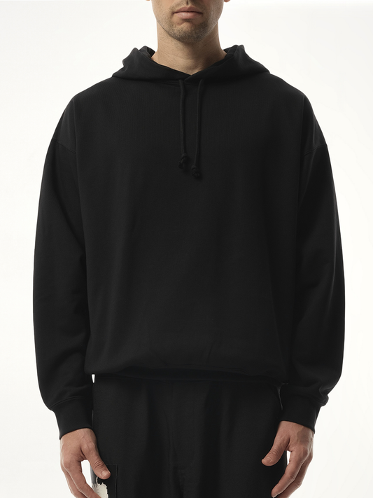 Image of a model wearing Outerwear. Productname: Y-3 Unisex Pun Logo Hoodie in Black colour by brand - Y-3