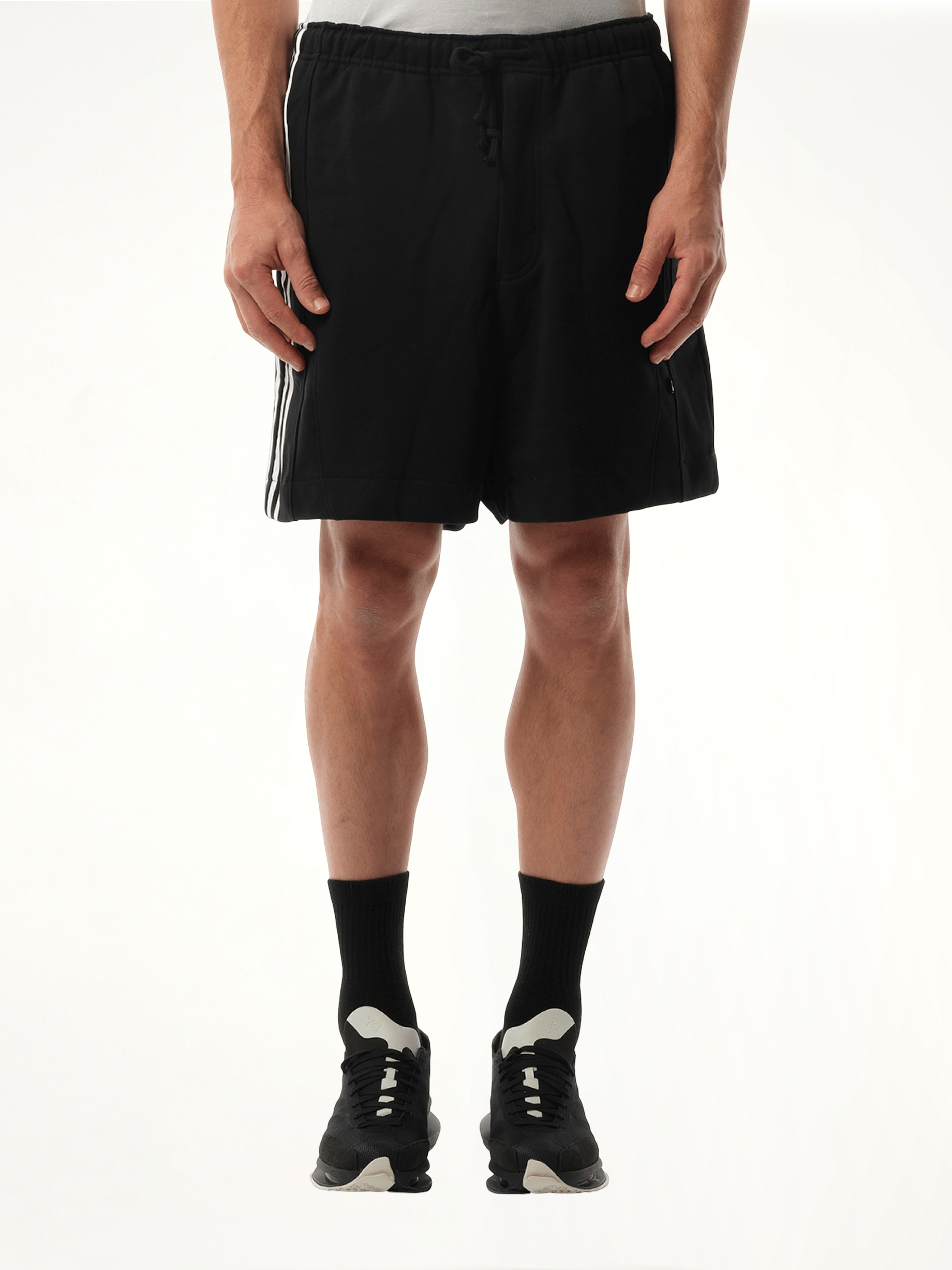 Image of a model wearing Shorts. Productname: Y-3 Football Cutout Shorts in Black colour by brand - Y-3