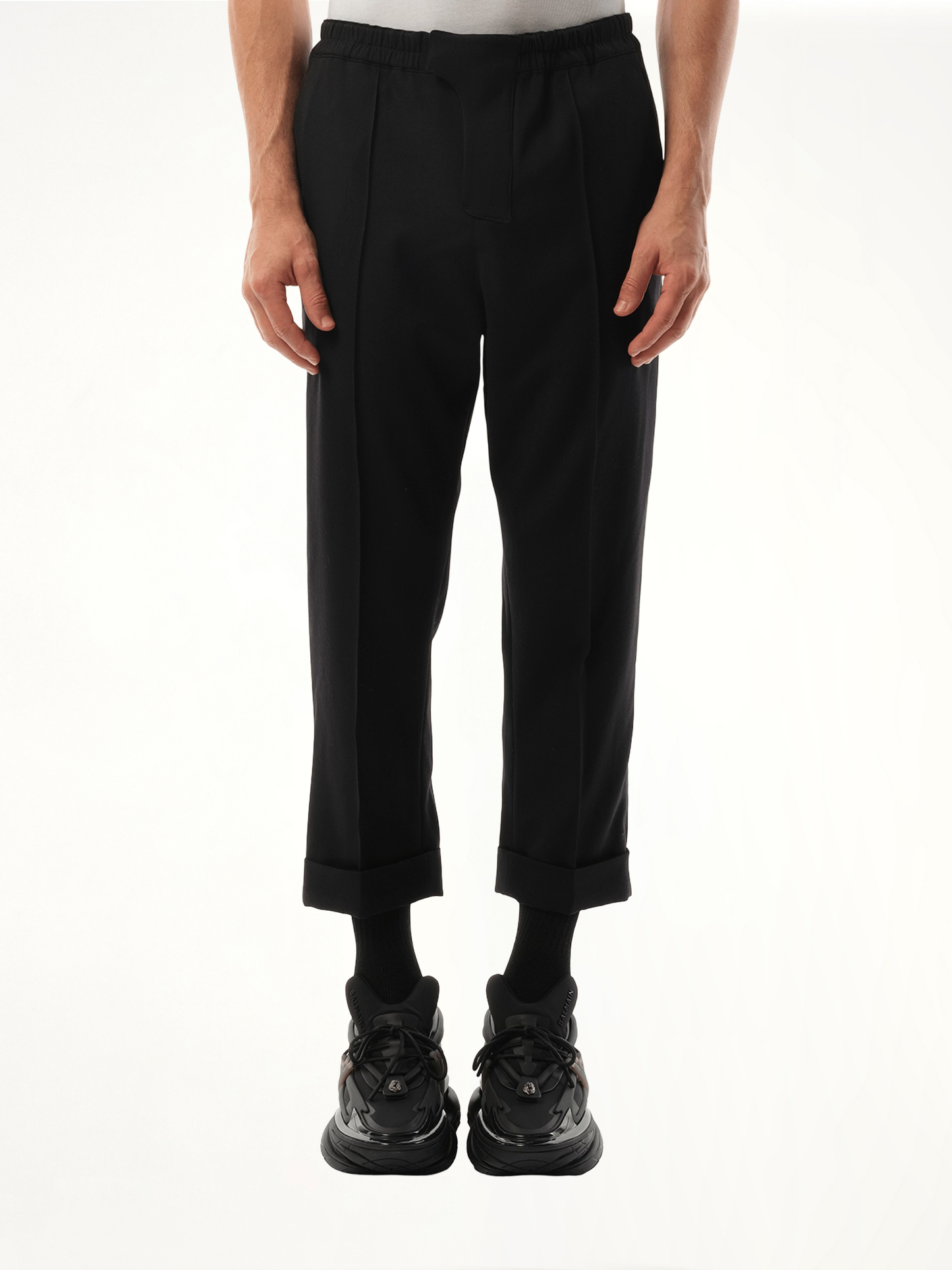 Image of a model wearing Pants. Productname: BALMAIN Tailored GDP Slouch Pants in BLACK colour by brand - BALMAIN
