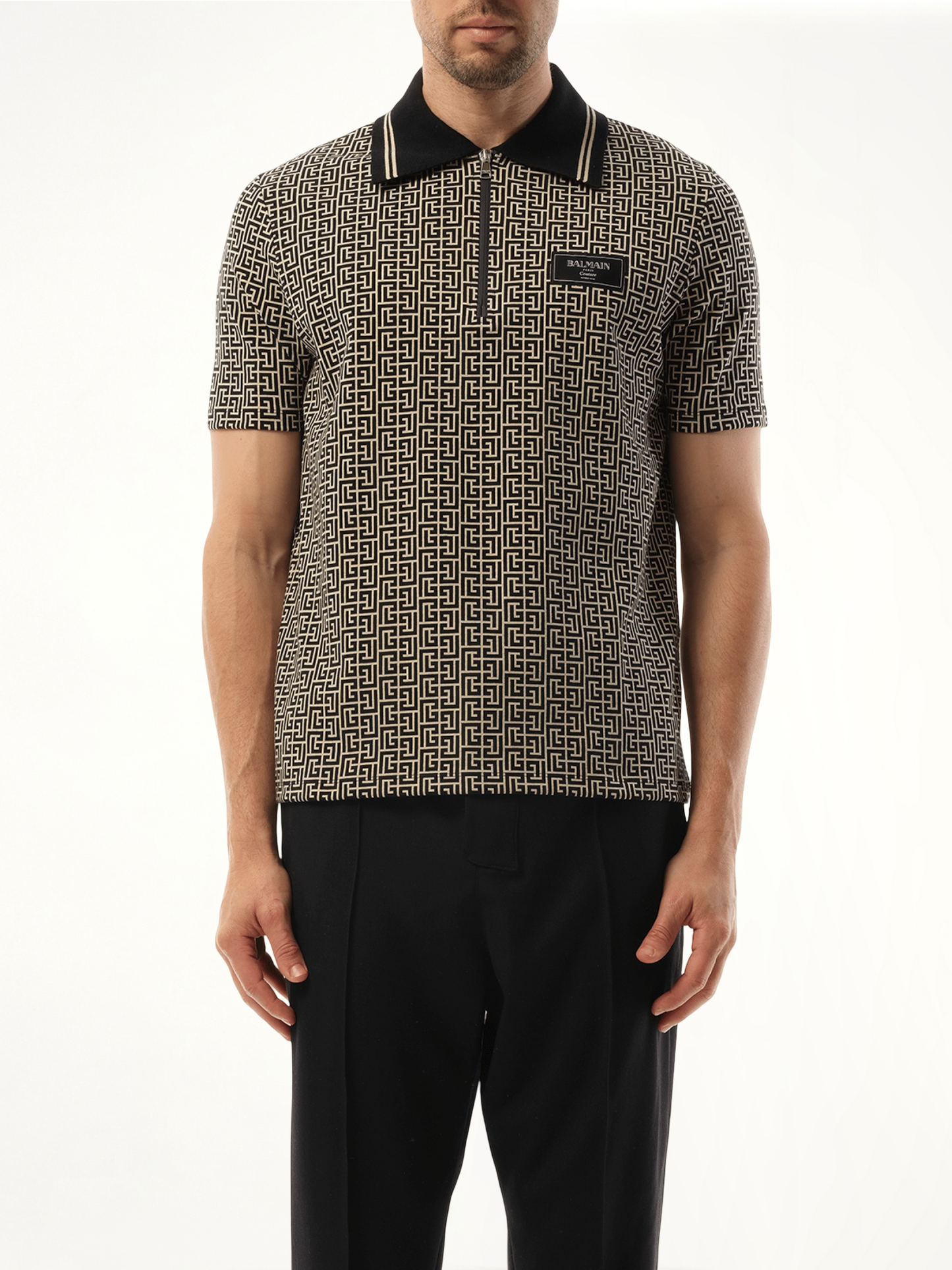 Image of a model wearing Tops. Productname: BALMAIN Monogram Couture Label Zipped Polo in Ivory/Black colour by brand - BALMAIN