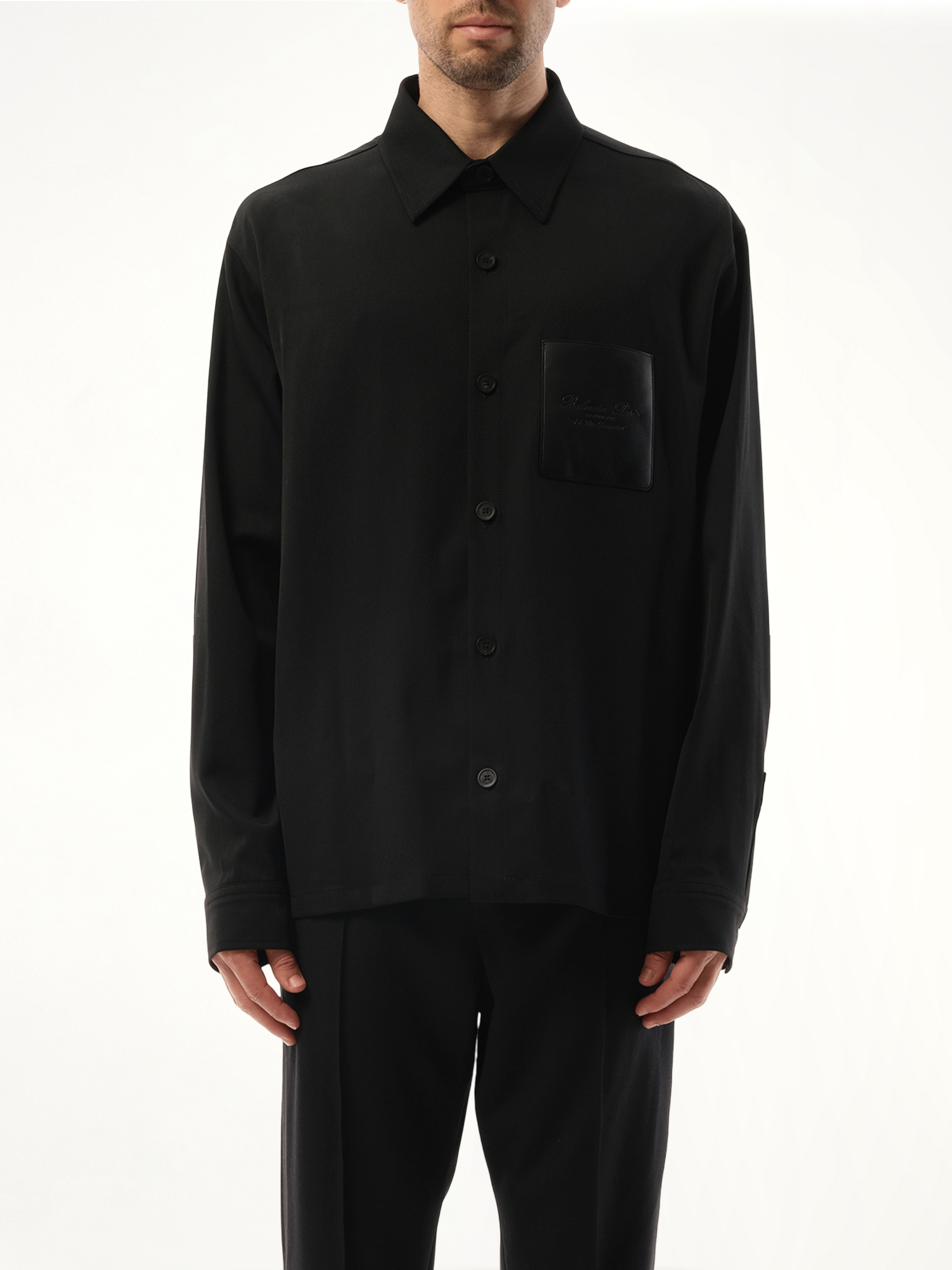 Image of a model wearing Outerwear. Productname: BALMAIN Couture Label GDP Overshirt in Black colour by brand - BALMAIN