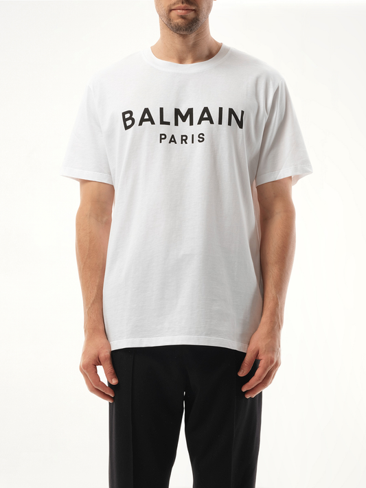 Image of a model wearing Tops. Productname: BALMAIN Balmain Print Reg Fit T-Shirt in White colour by brand - BALMAIN