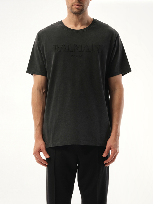 Image of a model wearing Tops. Productname: BALMAIN Balmain Vintage Emb T-Shirt in Grey colour by brand - BALMAIN