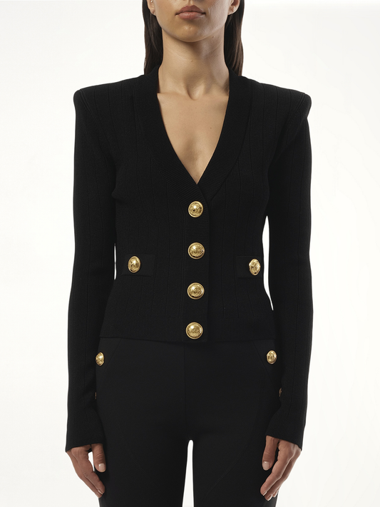 Image of a model wearing Outerwear. Productname: BALMAIN V-Neck 2 Pockets Buttoned Knit Cardigan in Black colour by brand - BALMAIN