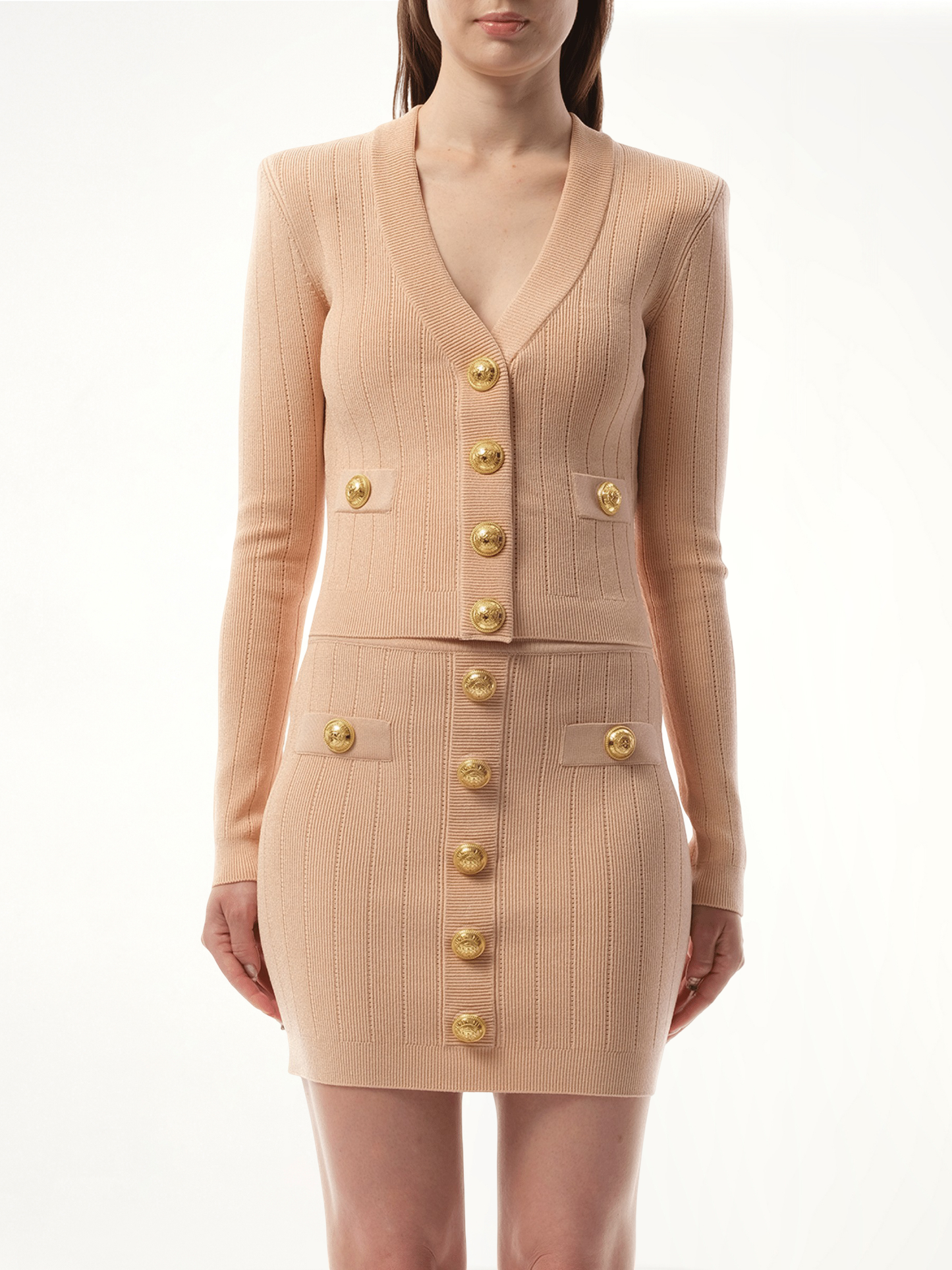 Image of a model wearing Outerwear. Productname: BALMAIN V-Neck 2 Pockets Buttoned Knit Cardigan in PINK colour by brand - BALMAIN