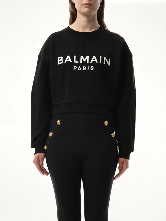 Image of a model wearing Outerwear. Product name - 3 Button Balmain Printed Sweatshirt in Black colour by brand - BALMAIN