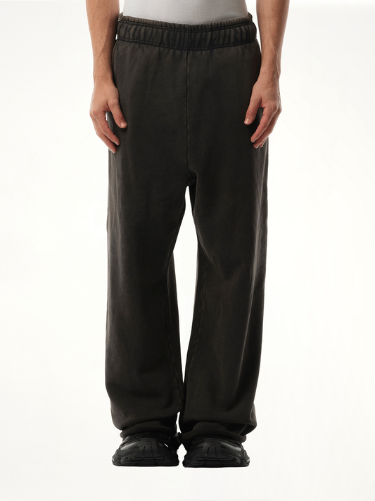 Image of a model wearing Pants. Product name - Full Sweatpants in Black colour by brand - ENTIRE STUDIOS
