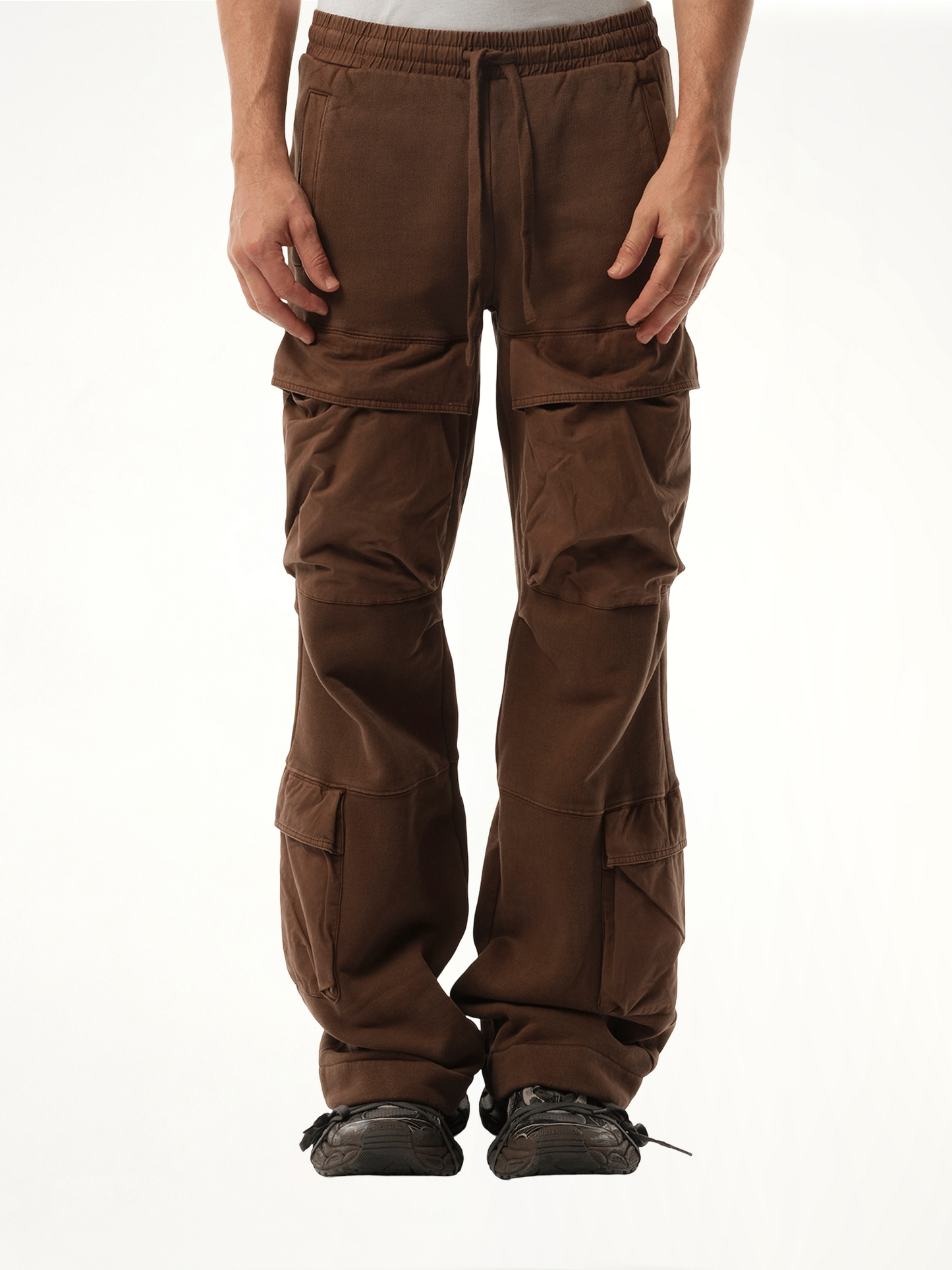 Image of a model wearing Pants. Productname: ENTIRE STUDIOS Utility Sweatpants in BROWN colour by brand - ENTIRE STUDIOS
