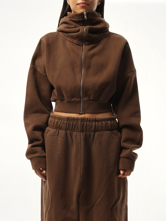 Image of a model wearing Outerwear. Productname: ENTIRE STUDIOS Cropped Full Zip Hoodie in BROWN colour by brand - ENTIRE STUDIOS