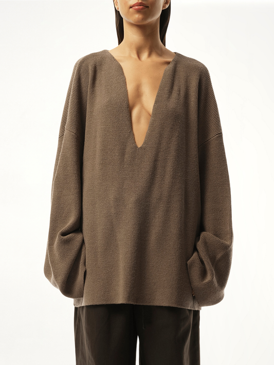 Image of a model wearing Outerwear. Productname: ENTIRE STUDIOS Dormer Knit Sweater in BROWN colour by brand - ENTIRE STUDIOS