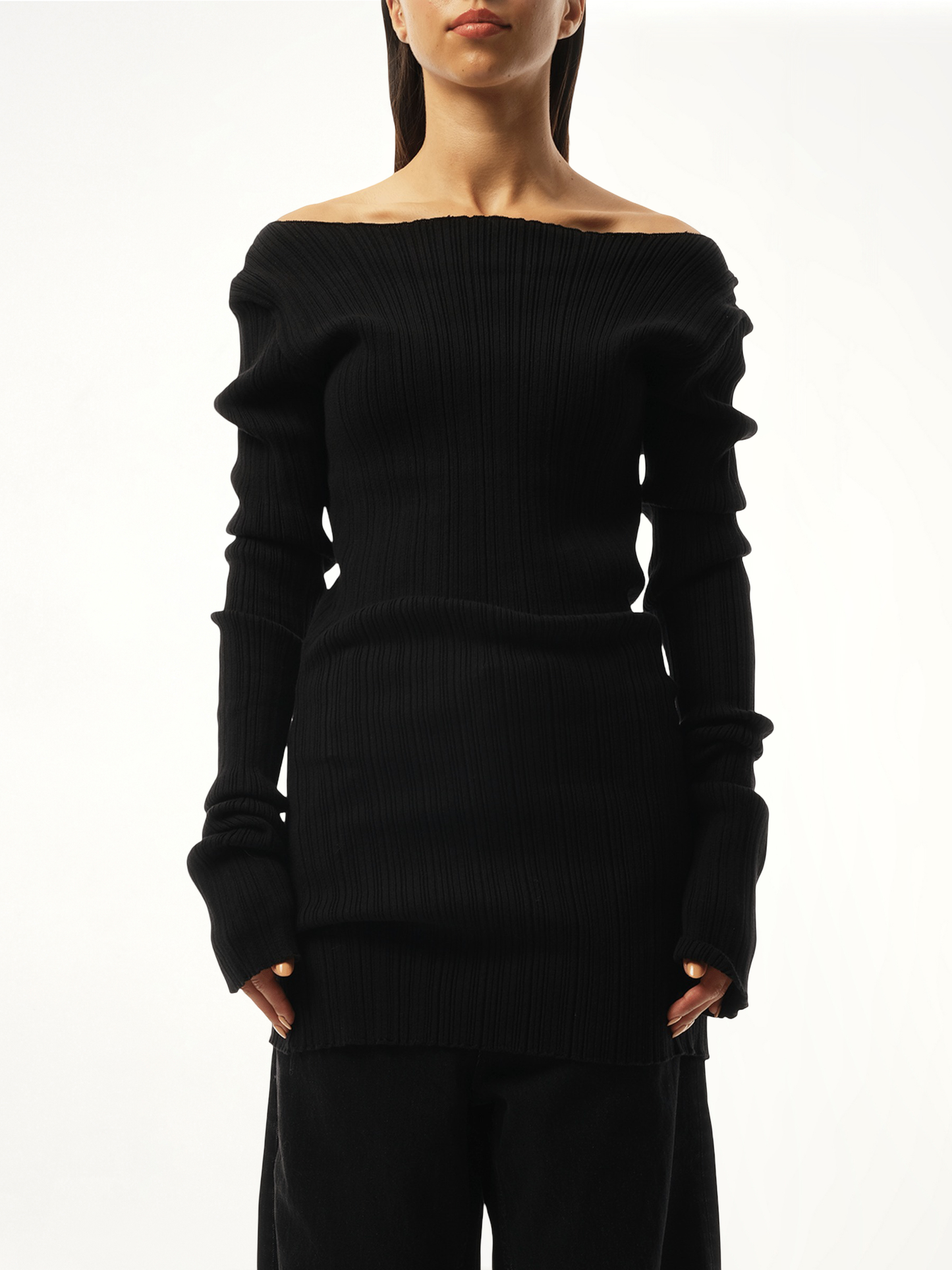 Image of a model wearing Outerwear. Product name - Arches Long Sleeve Knit Sweater in Black colour by brand - ENTIRE STUDIOS