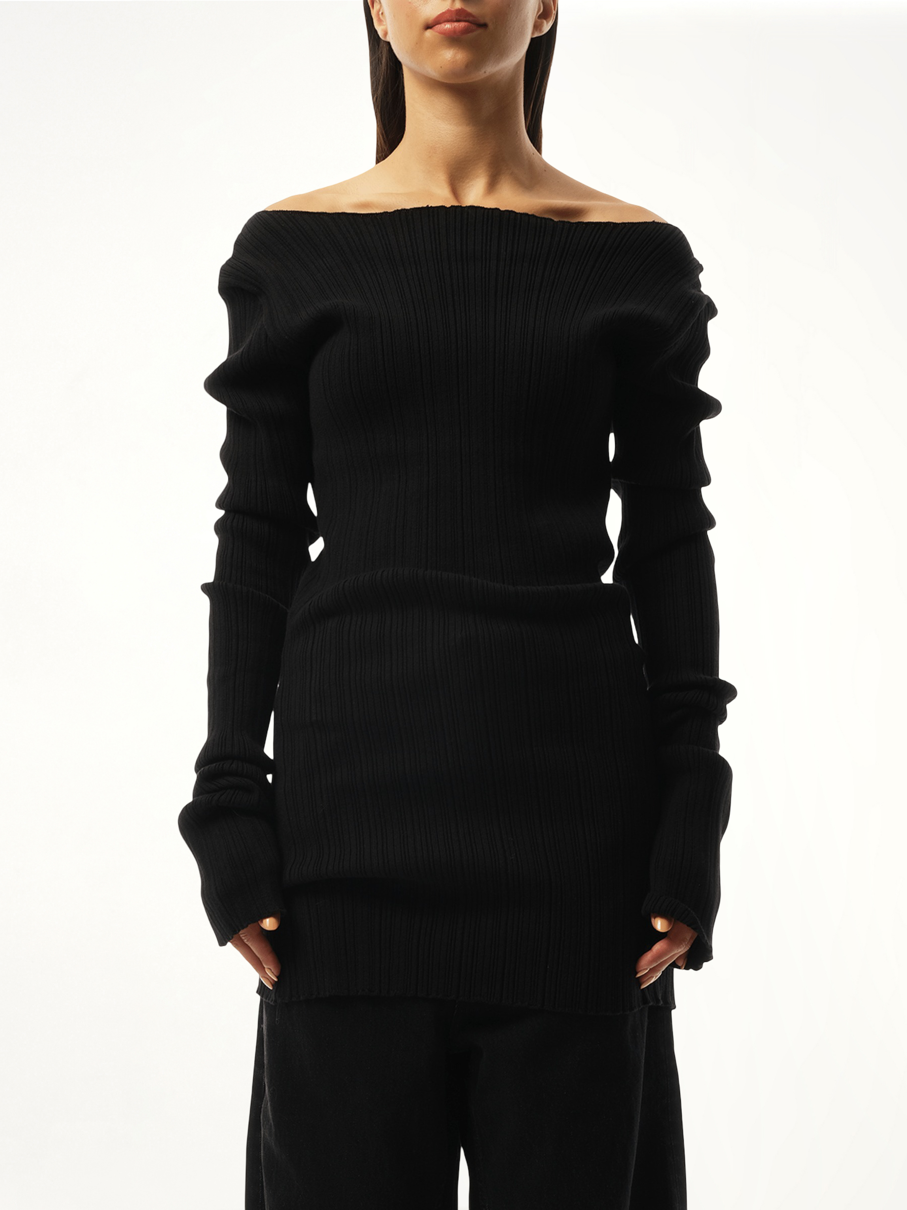 Image of a model wearing Outerwear. Product name - Arches Long Sleeve Knit Sweater in Black colour by brand - ENTIRE STUDIOS