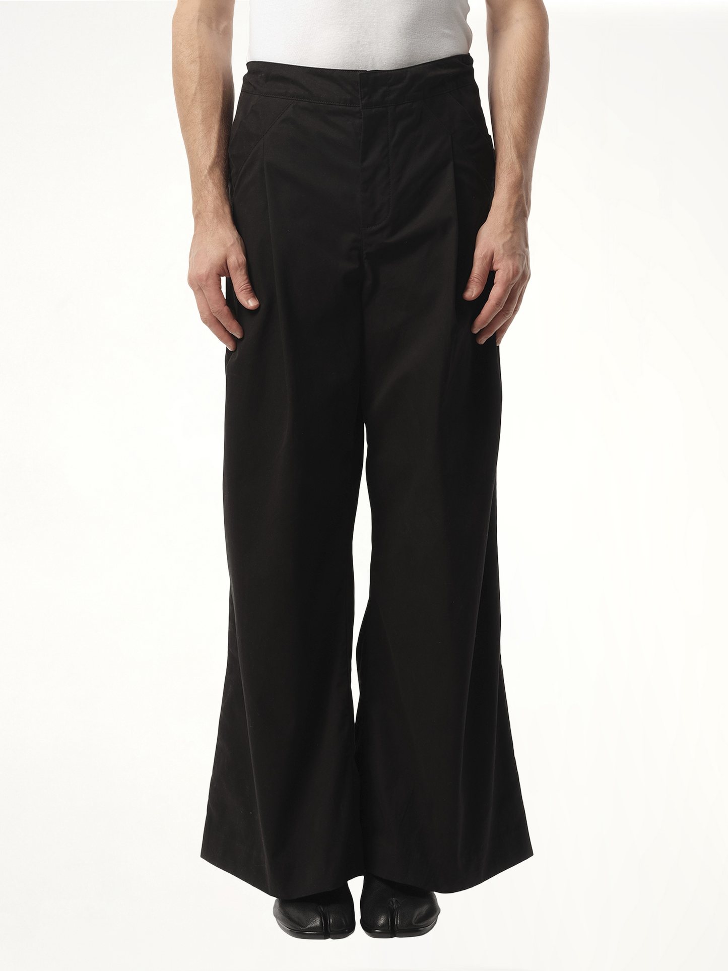 Image of a model wearing Pants. Product name - Wares Pant in Black colour by brand - ENTIRE STUDIOS