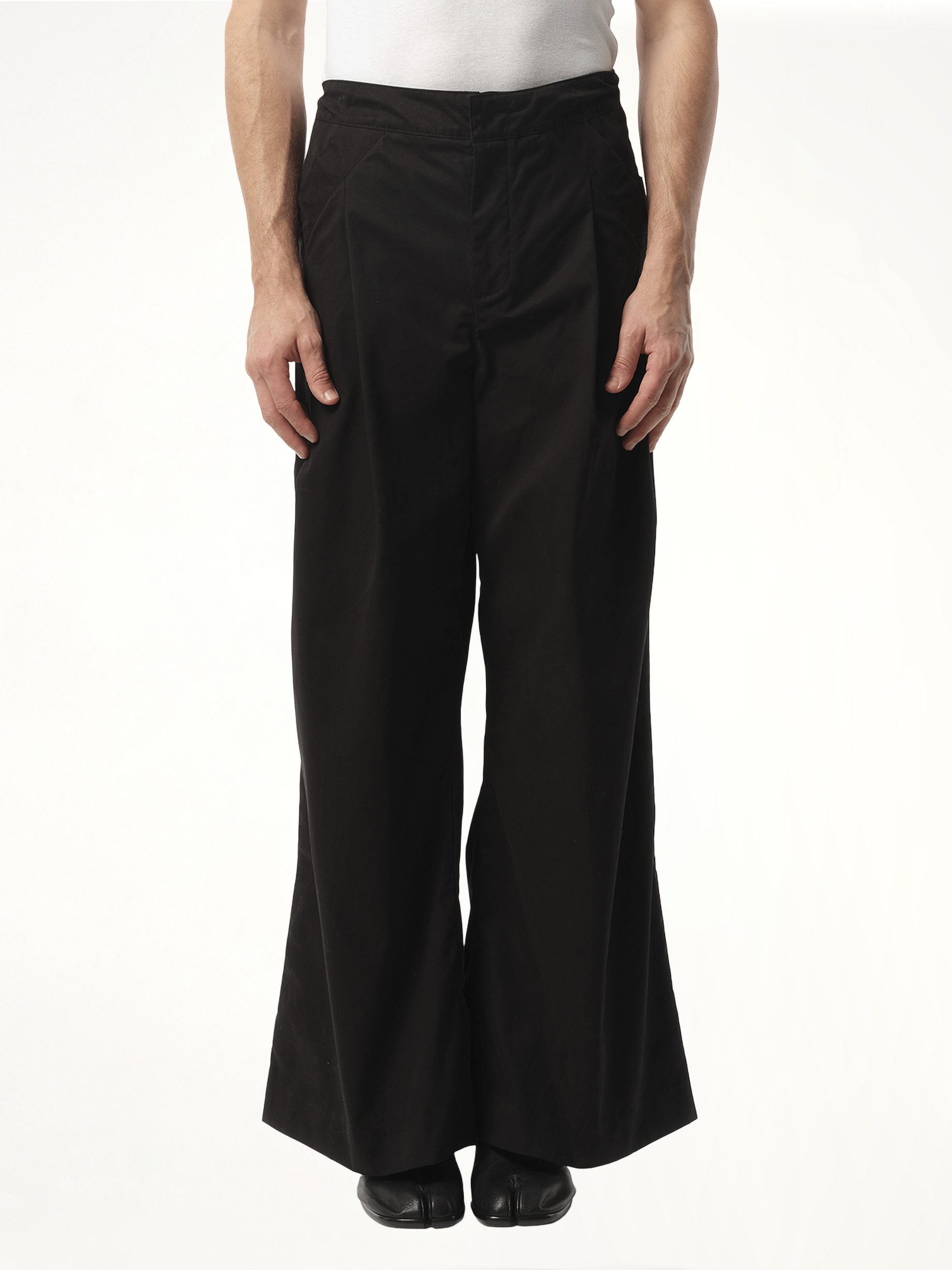 Image of a model wearing Pants. Product name - Wares Pant in Black colour by brand - ENTIRE STUDIOS