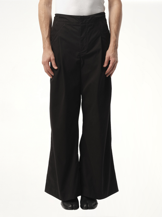 Image of a model wearing Pants. Product name - Wares Pant in Black colour by brand - ENTIRE STUDIOS