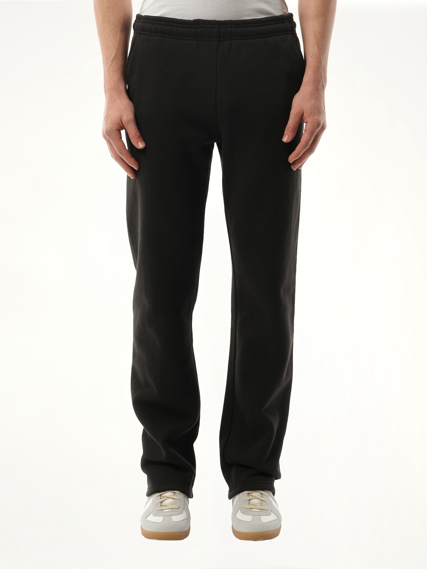 Image of a model wearing Pants. Product name - Heavy Sweatpants in Black colour by brand - ENTIRE STUDIOS