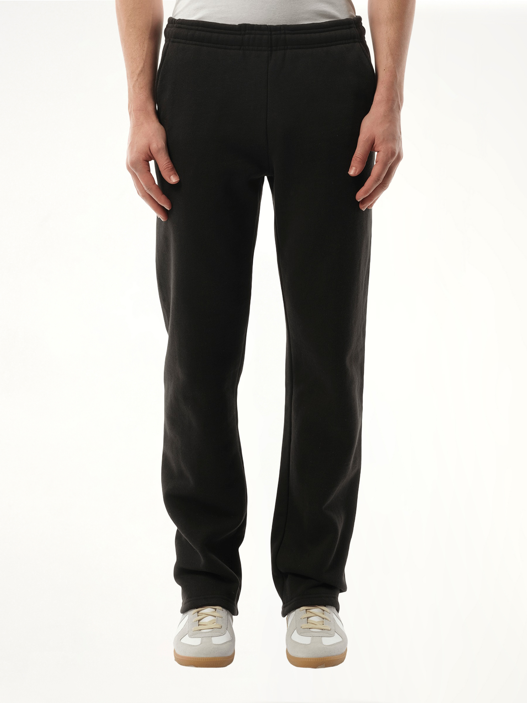 Image of a model wearing Pants. Product name - Heavy Sweatpants in Black colour by brand - ENTIRE STUDIOS
