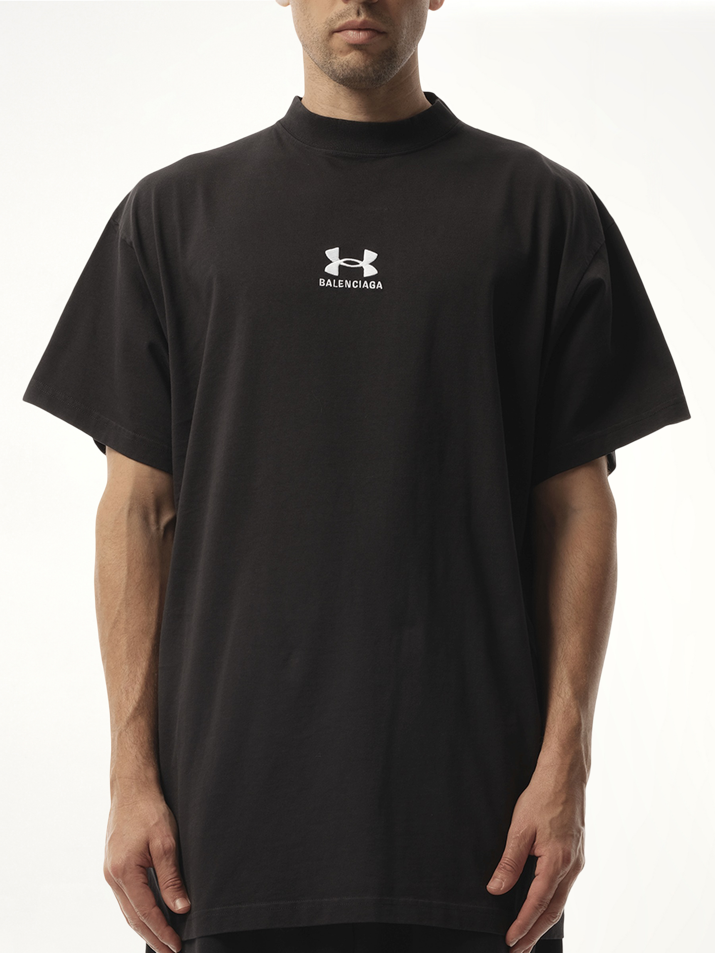 Image of a model wearing Tops. Productname: BALENCIAGA Under Armour Oversized T-Shirt in Black colour by brand - BALENCIAGA