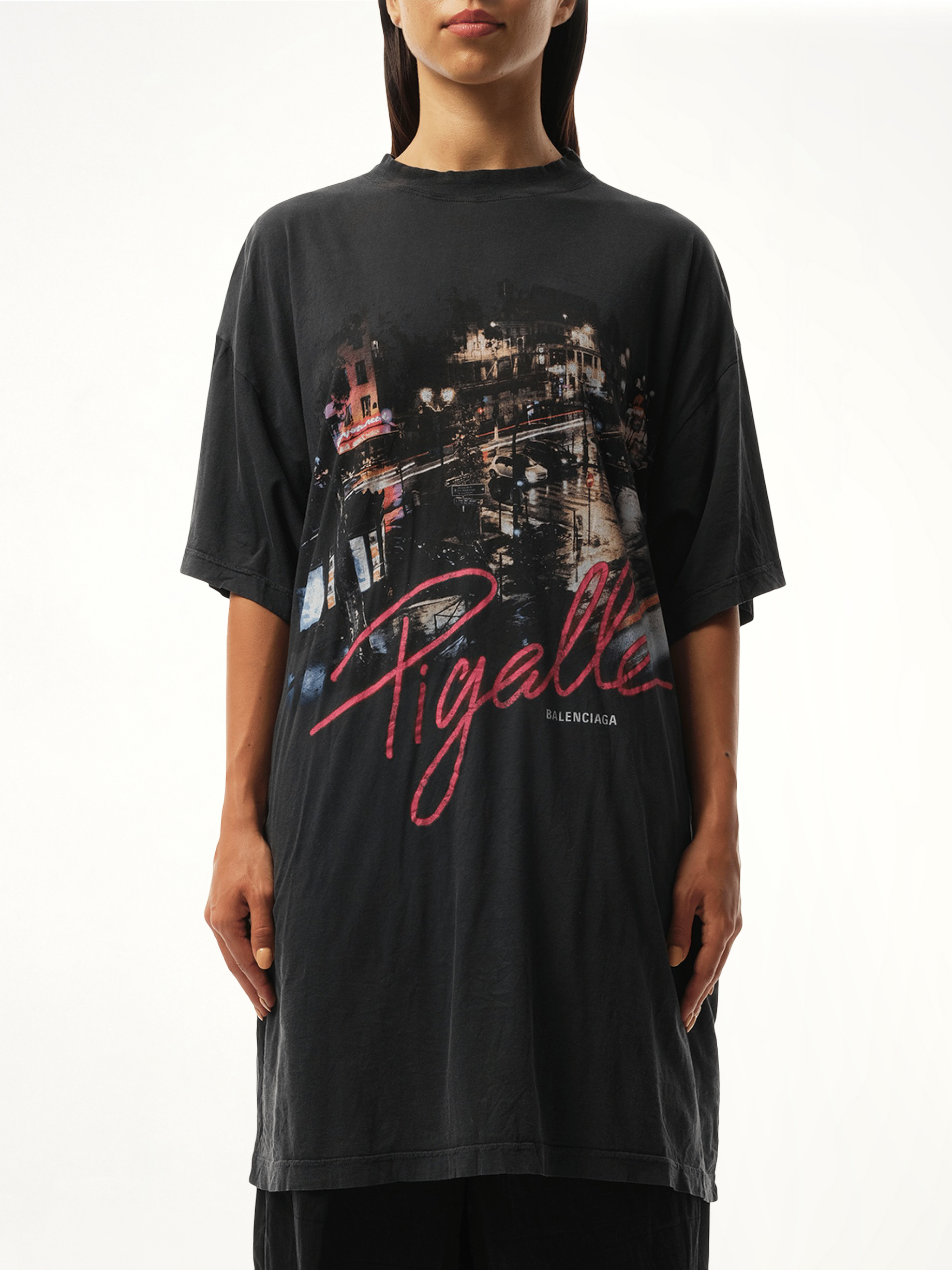 Image of a model wearing Tops. Productname: BALENCIAGA Pigalle Oversized T-Shirt in Black colour by brand - BALENCIAGA