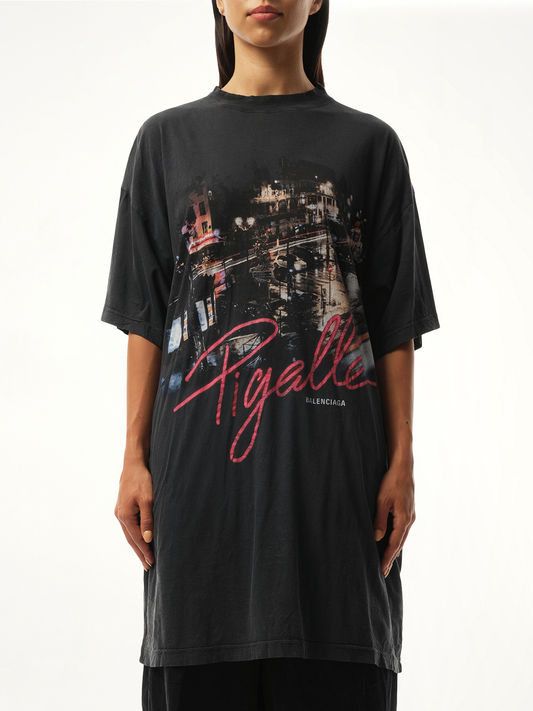 Image of a model wearing Tops. Productname: BALENCIAGA Pigalle Oversized T-Shirt in Black colour by brand - BALENCIAGA