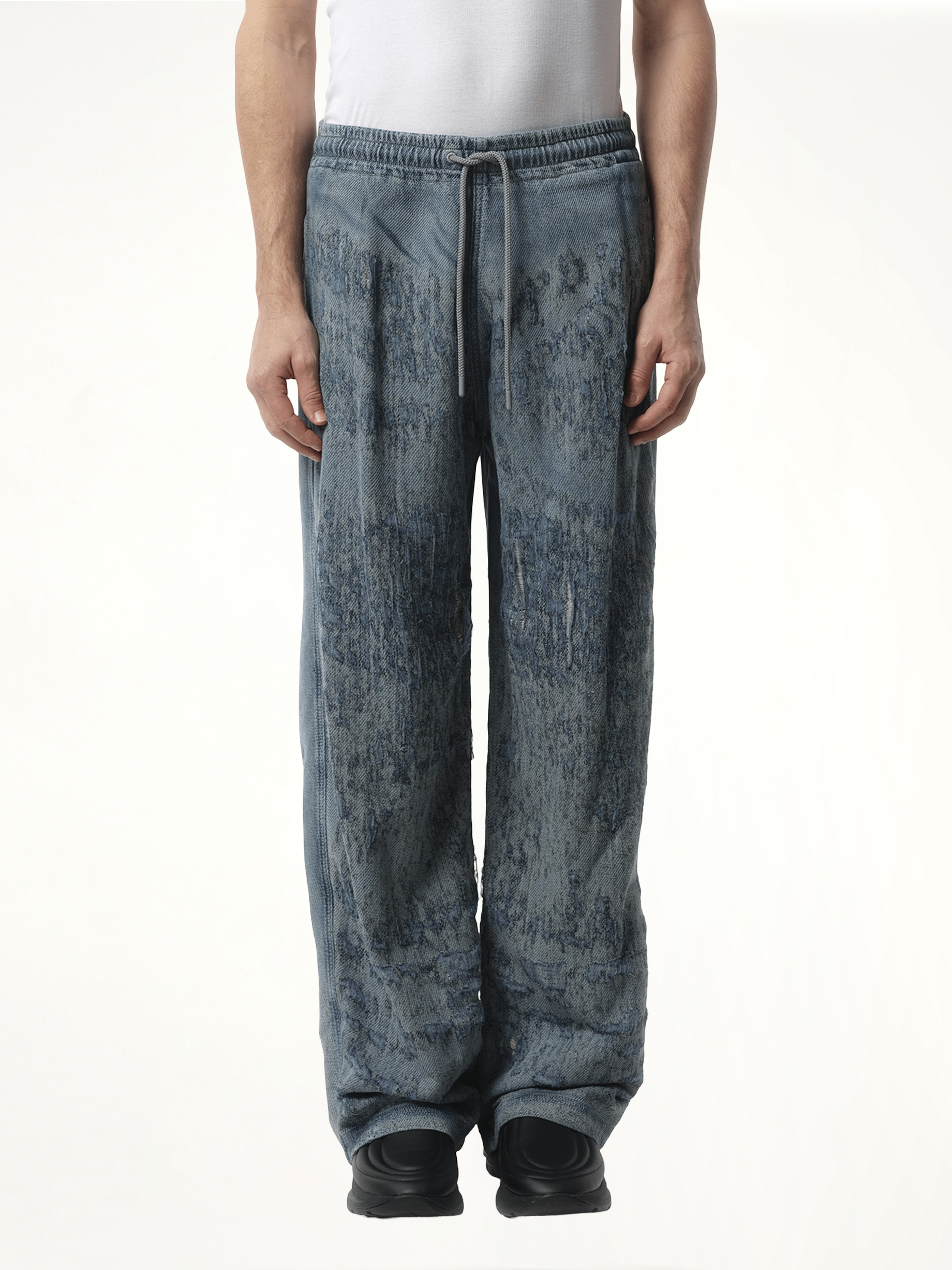 Image of a model wearing Pants. Productname: DIESEL Runway Enimos Pants in Blue colour by brand - DIESEL