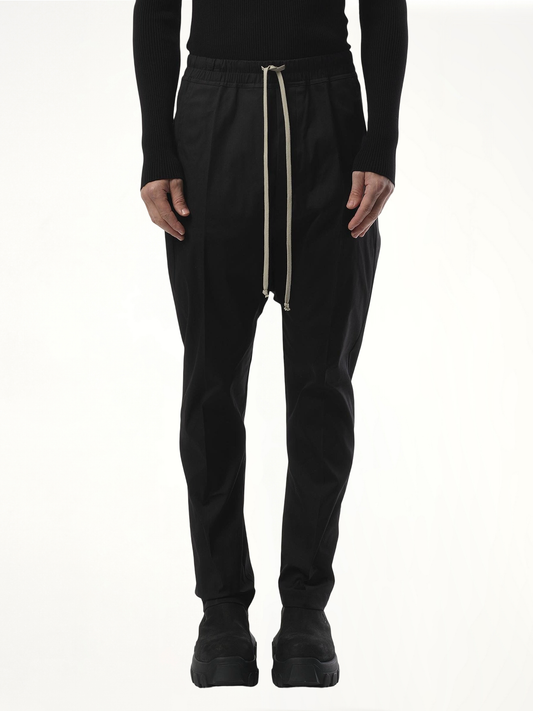 Image of a model wearing Pants. Productname: RICK OWENS Drawstring Long Pants in Black colour by brand - RICK OWENS