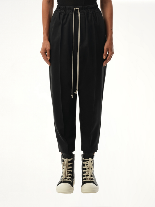 Image of a model wearing Pants. Productname: RICK OWENS Drawstring Astaires Cropped Pants in Black colour by brand - RICK OWENS