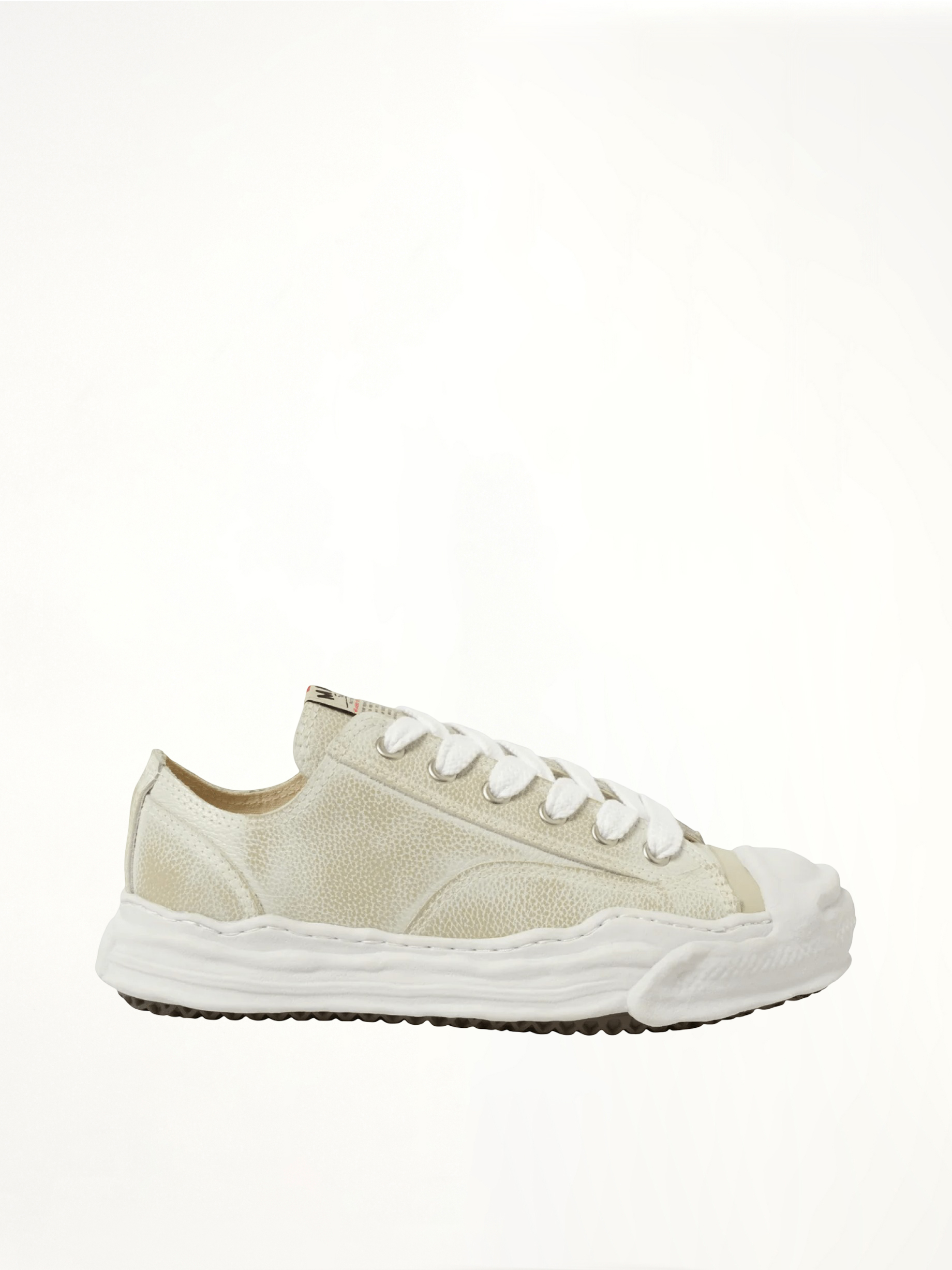 Image of Sneakers. Product name - Hank OG Shrink Leather Sneaker in White colour by brand - MAISON MIHARA YASUHIRO
