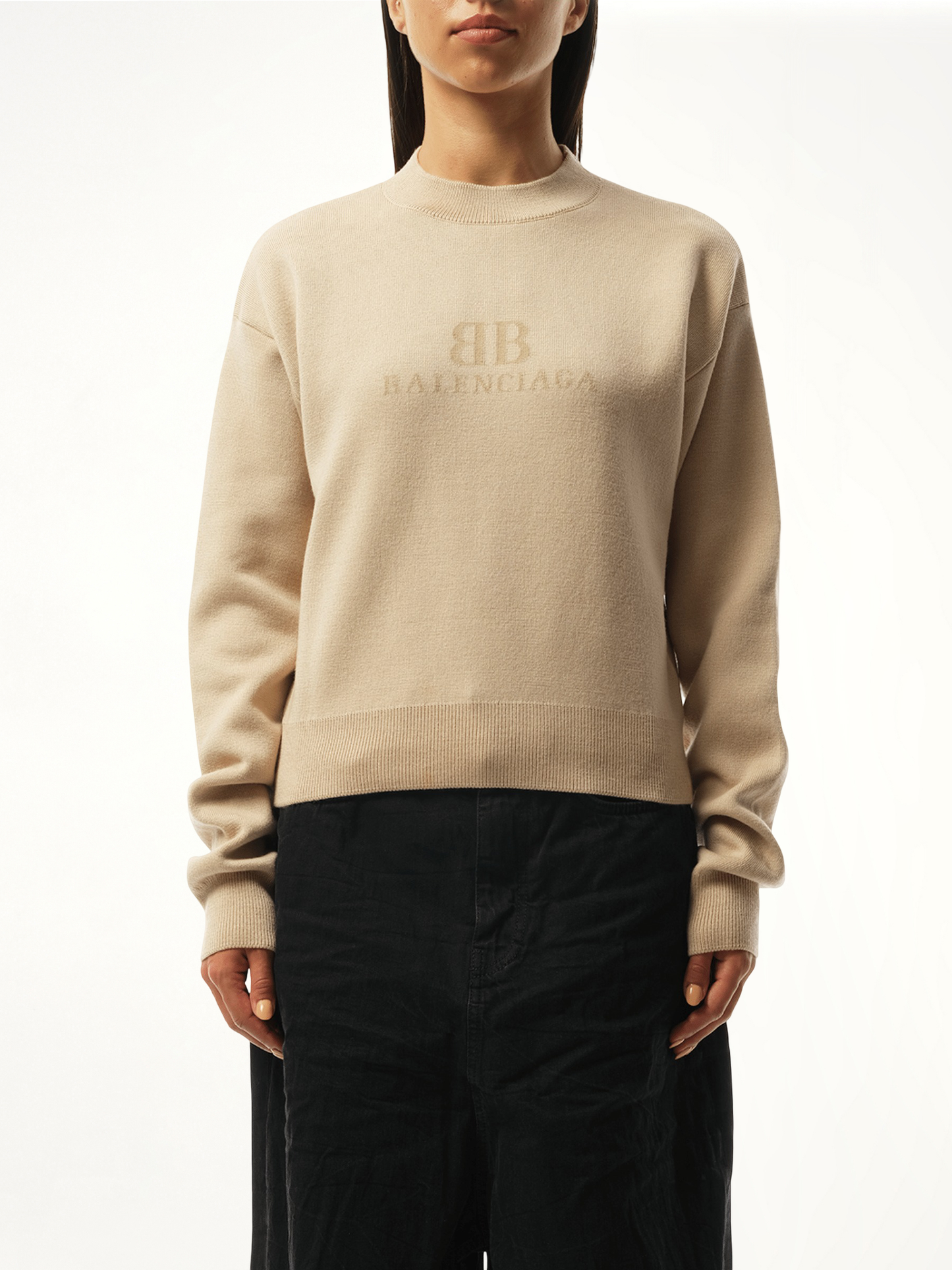 Image of a model wearing Outerwear. Productname: BALENCIAGA Cropped Sweater in Beige colour by brand - BALENCIAGA