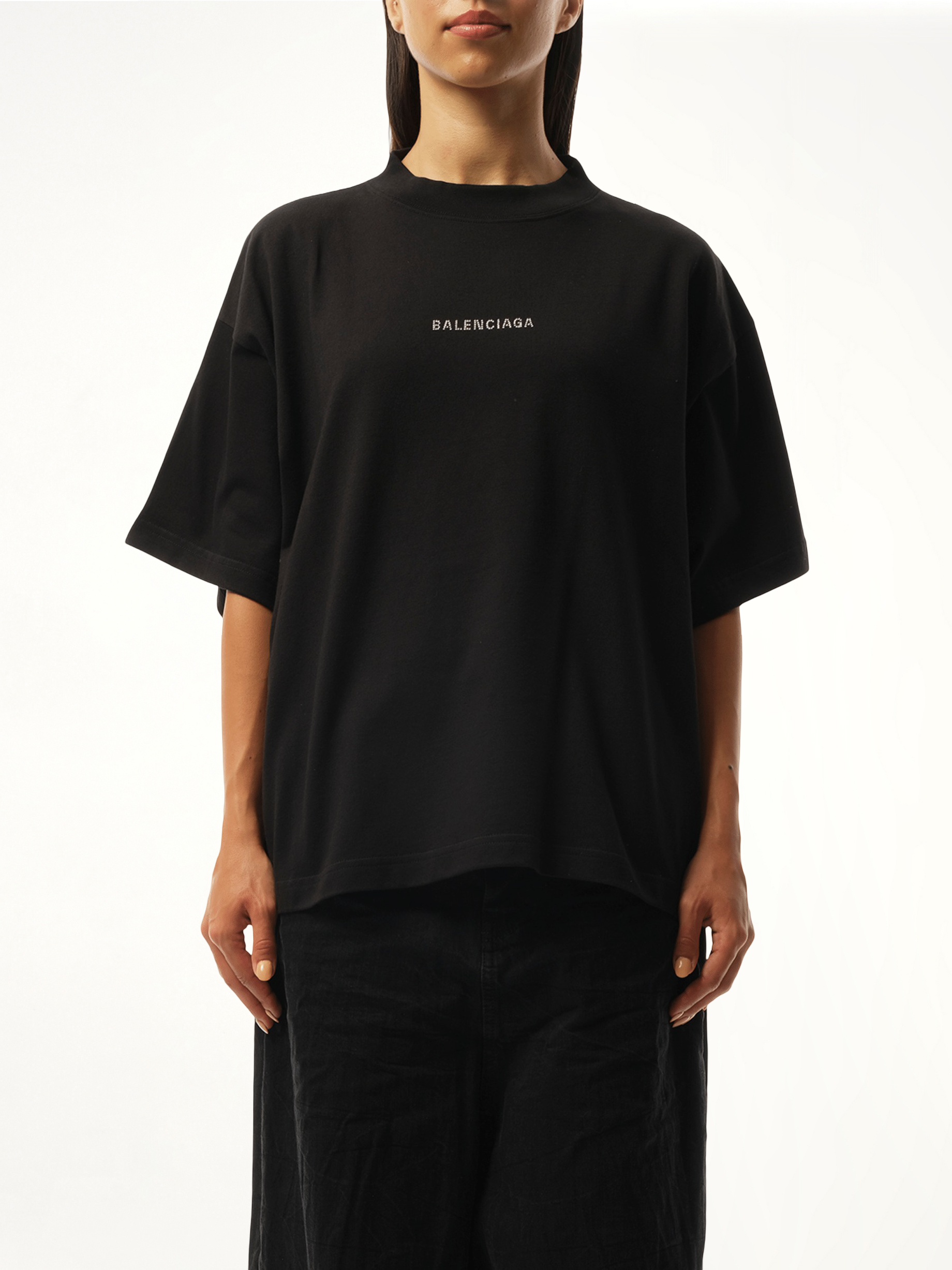 Image of a model wearing Tops. Productname: BALENCIAGA Paris Strass Cropped T-Shirt in Black colour by brand - BALENCIAGA