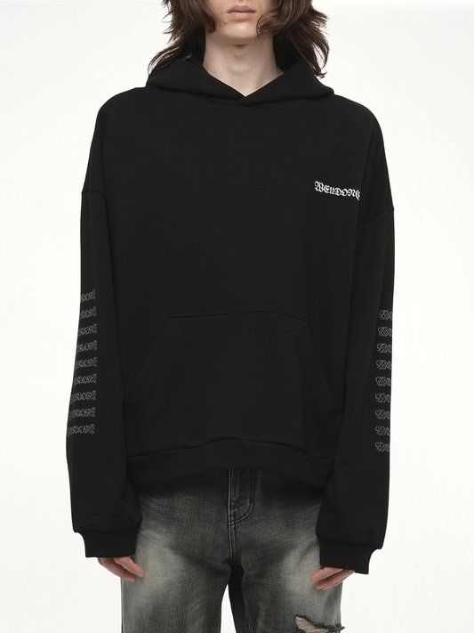 Image of a model wearing Outerwear. Productname: WE11DONE Punk Teddy Hoodie in Black colour by brand - WE11DONE