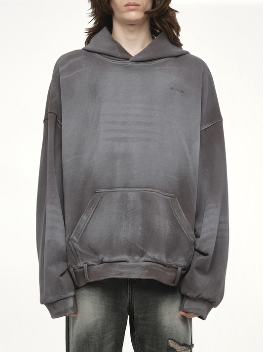 Image of a model wearing Outerwear. Productname: WE11DONE Spray Washed Hoodie in Black colour by brand - WE11DONE