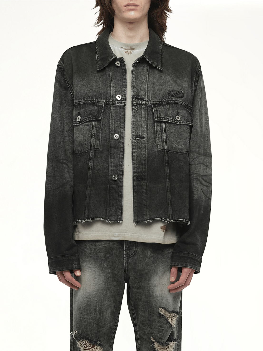 Image of a model wearing Outerwear. Productname: WE11DONE Dark-Spray Detail Denim Jacket in Black colour by brand - WE11DONE
