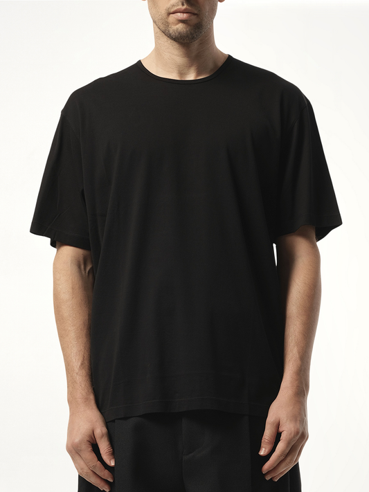 Image of a model wearing Tops. Productname: LEMAIRE Relaxed T-Shirt in Black colour by brand - LEMAIRE