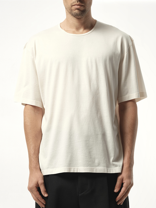 Image of a model wearing Tops. Productname: LEMAIRE Relaxed T-Shirt in White colour by brand - LEMAIRE