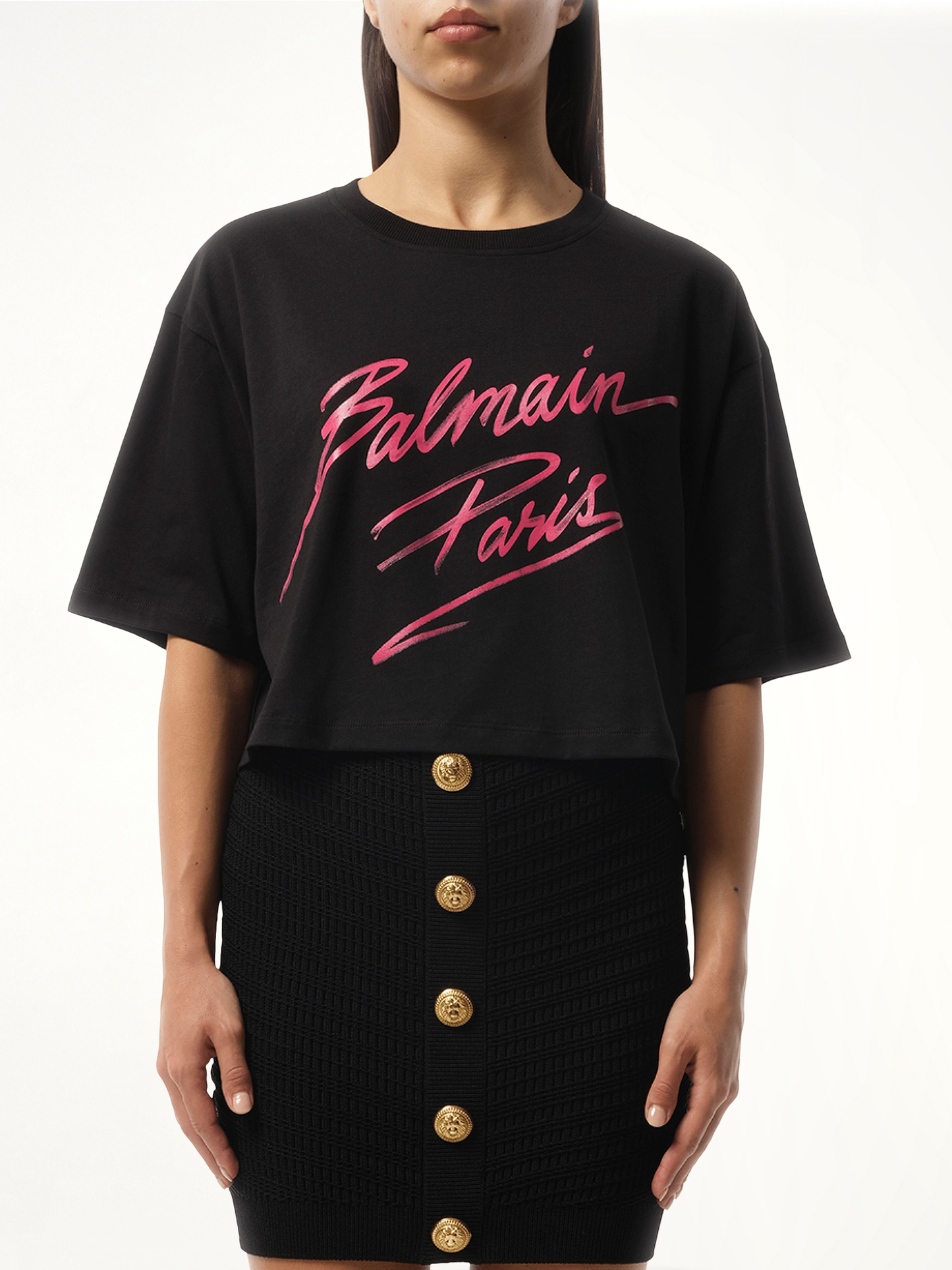 Image of a model wearing Tops. Productname: BALMAIN Balmain Baseball Cropped T-Shirt in PINK colour by brand - BALMAIN