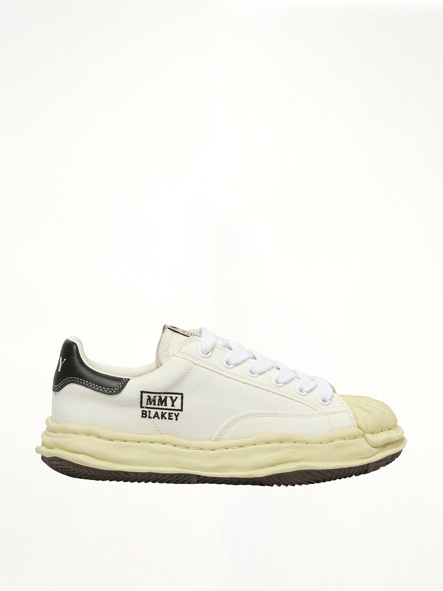 Image of Sneakers. Product name - Blakey OG Vintage Leather Low Sneaker in White colour by brand - MAISON MIHARA YASUHIRO