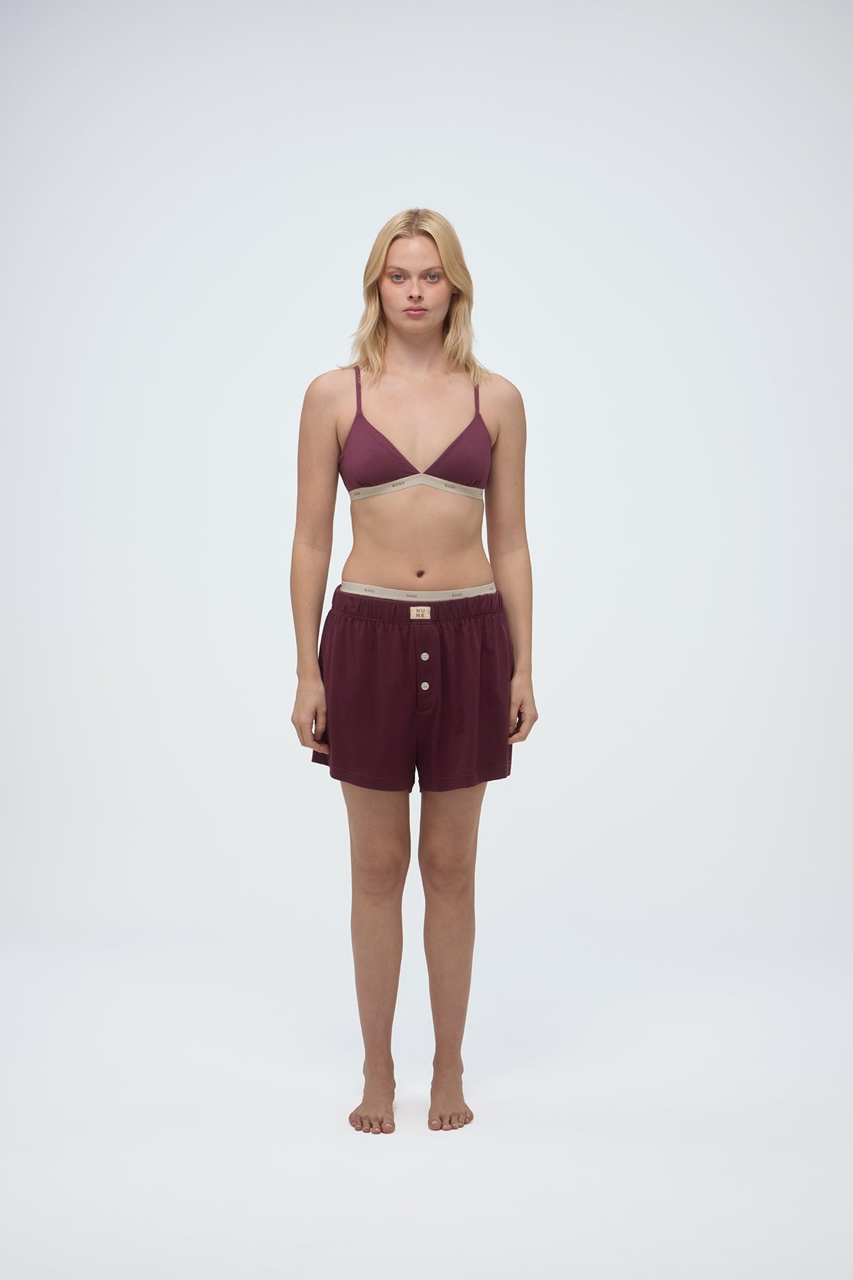 Image of a model wearing Tops. Product name - Triangle Bralette Twilight in Twilight colour by brand - NUNE