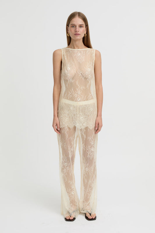 Image of a model wearing Pants. Product name - Riven Pants Cream in Cream colour by brand - Blanca Studio