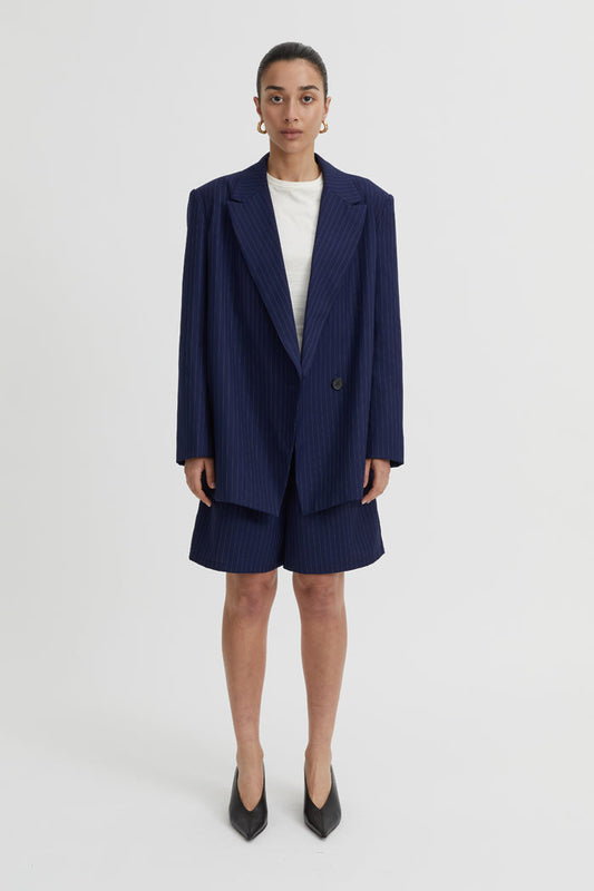 Image of a model wearing Outerwear. Product name - Lazara Blazer Navy in Navy colour by brand - Blanca Studio