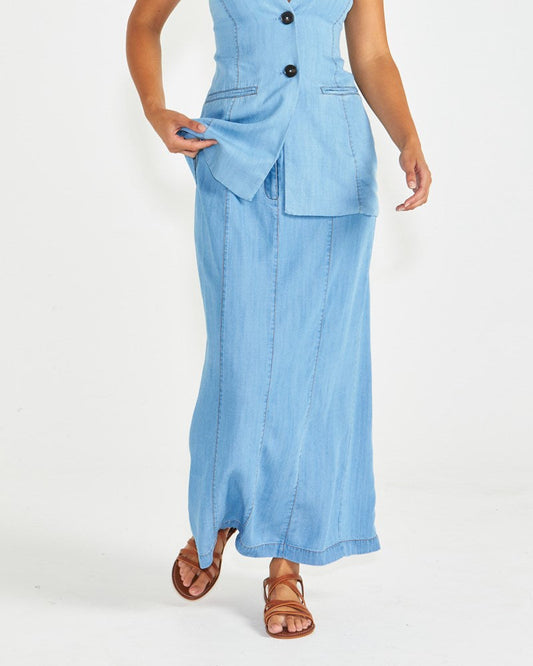 Image of a model wearing Skirts. Product name - Seville Maxi Skirt Chambray in Chambray colour by brand - Sass Clothing