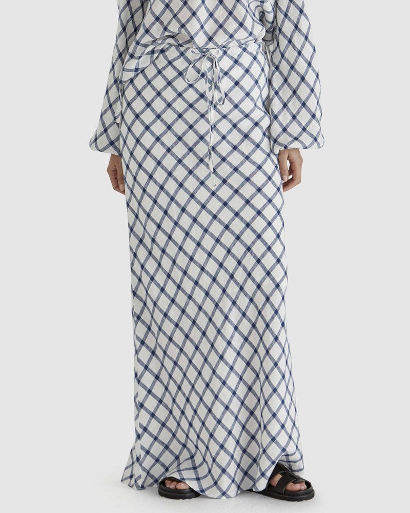 Image of a model wearing Skirts. Product name - Beau Bias Skirt in White Check colour by brand - Sass Clothing