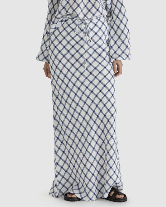 Image of a model wearing Skirts. Product name - Beau Bias Skirt in White Check colour by brand - Sass Clothing