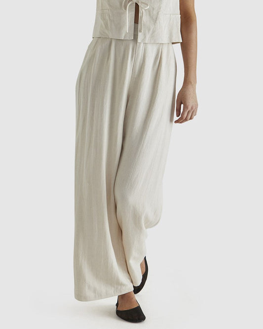 Image of a model wearing Pants. Product name - Natalia Pant Bone in Bone colour by brand - Sass Clothing