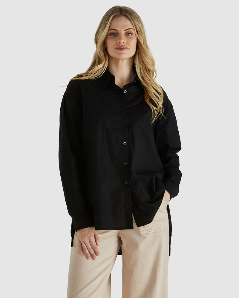 Image of a model wearing Tops. Product name - Belle Shirt Black in Black colour by brand - Sass Clothing