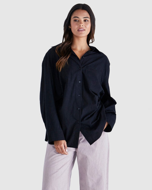 Image of a model wearing Tops. Product name - Nolan Top Black in Black colour by brand - Sass Clothing