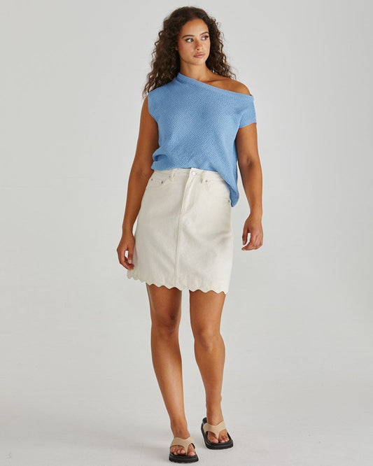 Image of a model wearing Skirts. Product name - Vale Scalloped Denim Skirt Parchment in Parchment colour by brand - Sass Clothing
