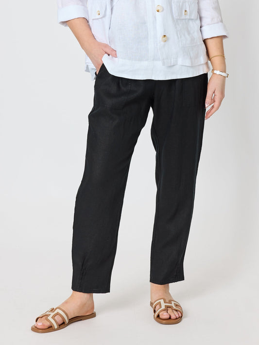 Image of a model wearing Pants. Product name - Sarah Linen Pleat Hem Pant Black in Black colour by brand - Gordon Smith