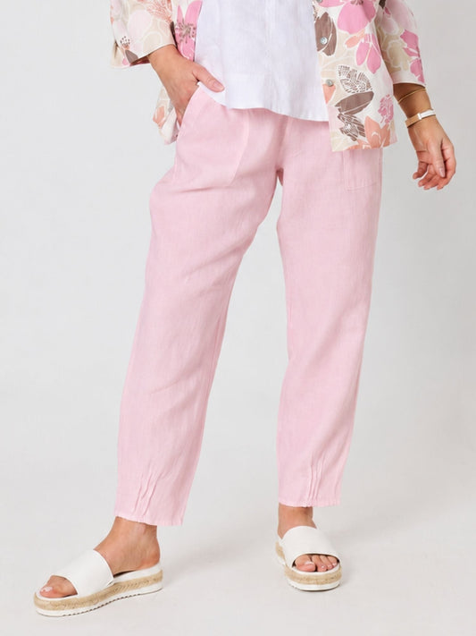 Image of a model wearing Pants. Product name - Sarah Linen Pleat Hem Pant Pale Pink in Pale Pink colour by brand - Gordon Smith